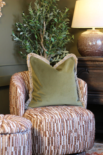 Langford Olive fringed velvet cushion in an earthy olive green, 55 x 55cm