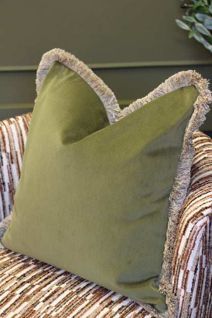 Langford Olive fringed velvet cushion in an earthy olive green, 55 x 55cm