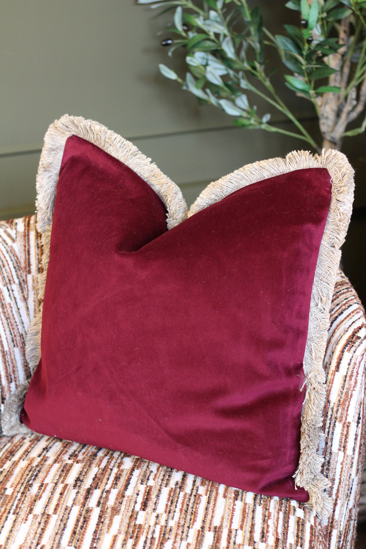 Langford Claret fringed velvet cushion in a deep claret tone, 55 x 55cm