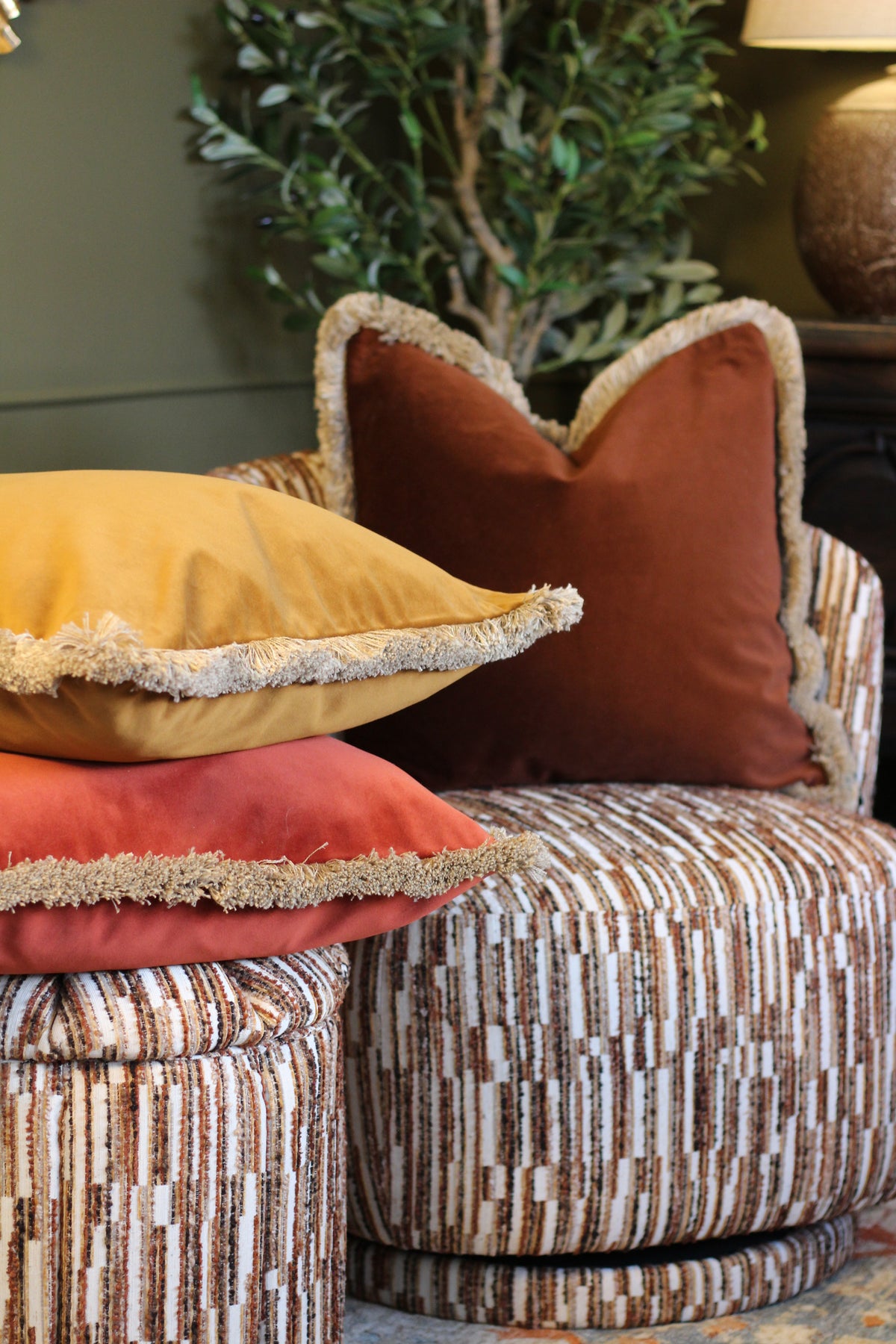Langford Rust fringed velvet cushion in a warm rust tone, 55 x 55cm