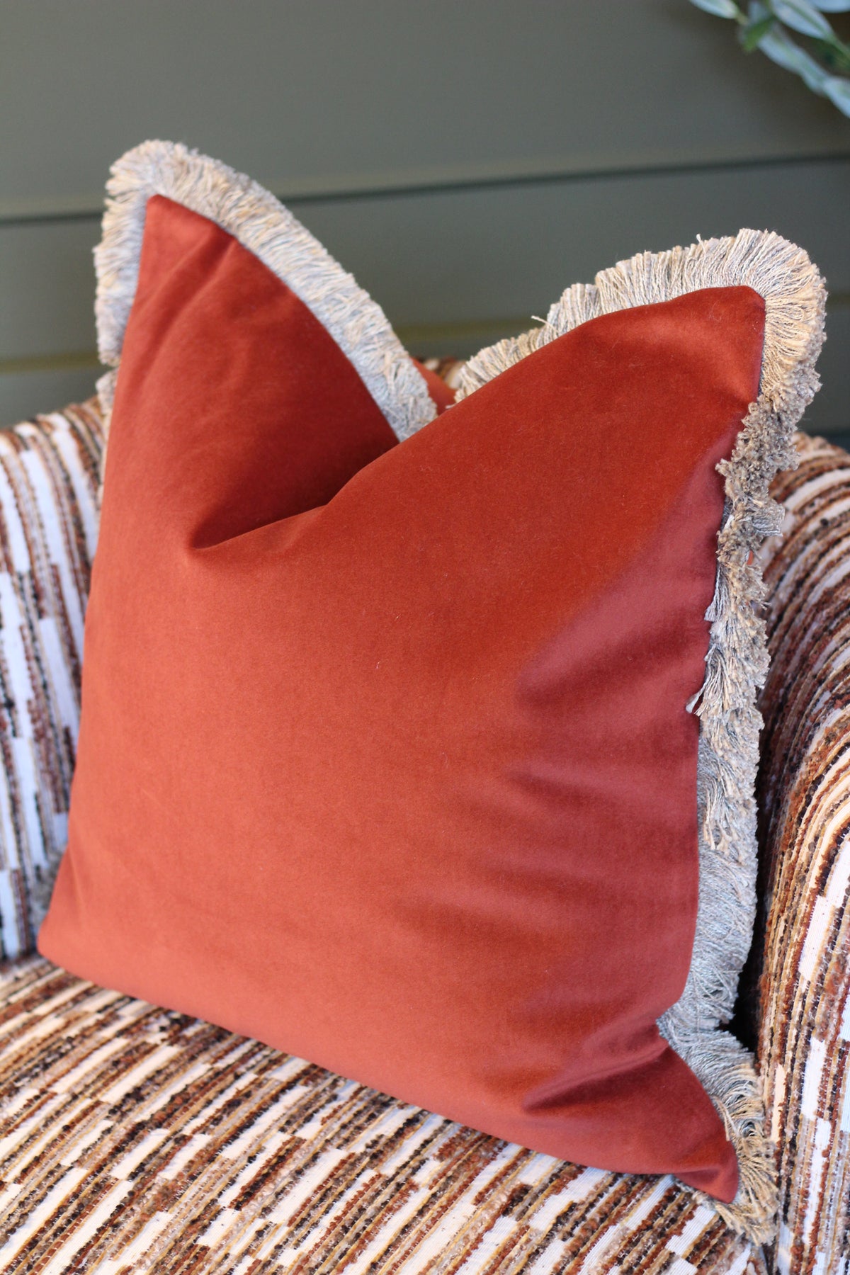 Langford Rust fringed velvet cushion in a warm rust tone, 55 x 55cm