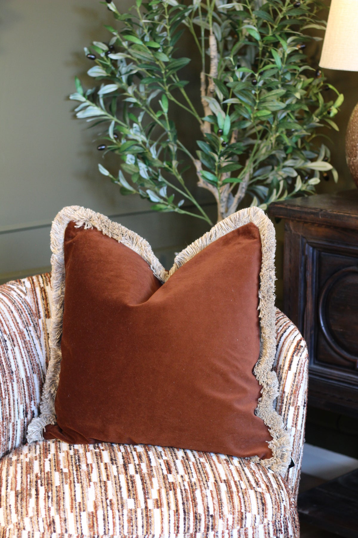 Langford Chestnut fringed velvet cushion in a rich warm brown, 55 x 55cm