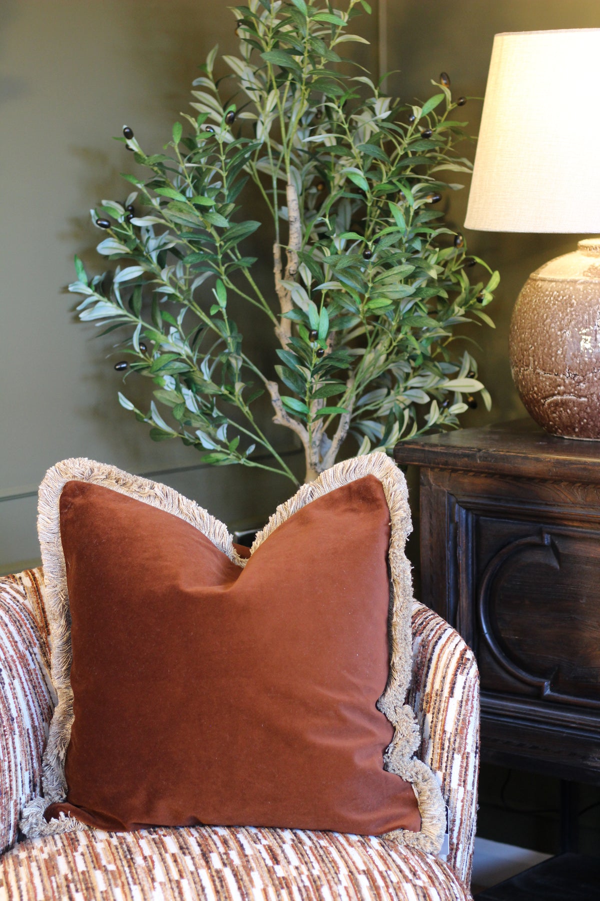 Langford Chestnut fringed velvet cushion in a rich warm brown, 55 x 55cm