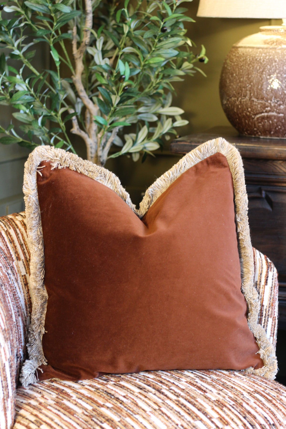 Langford Chestnut fringed velvet cushion in a rich warm brown, 55 x 55cm