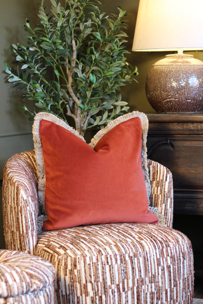 Langford Rust fringed velvet cushion in a warm rust tone, 55 x 55cm