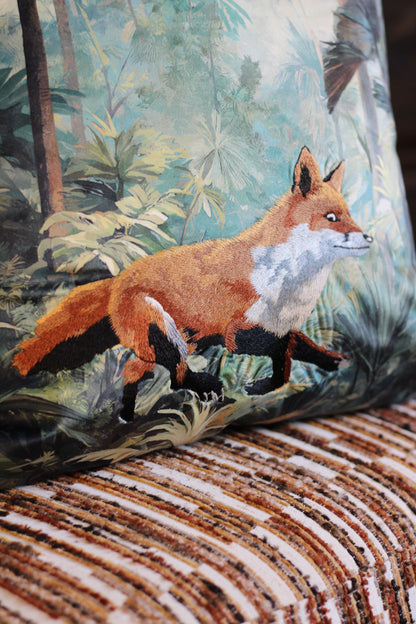Close-up of rust-coloured fox embroidery on Bracken green and blue forest cushion